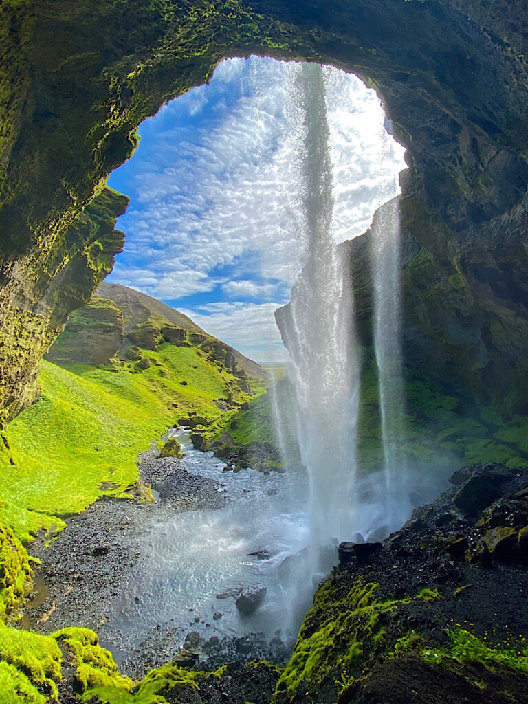 Picture of Kvernufoss Waterfall in Iceland from behind the drop in winter. Part of my South Coast Tour