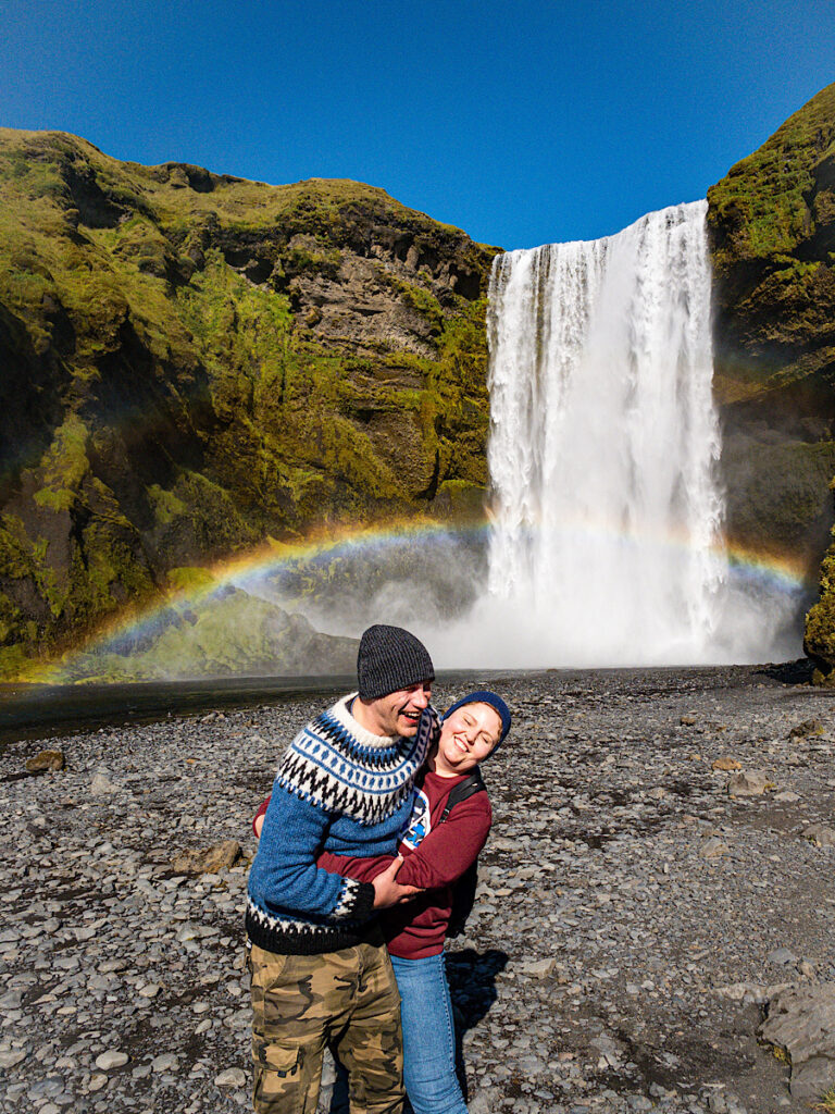 My guests by the Skógafoss waterfall in Iceland, with a rainbow. Part of the South Coast Tour by Arctic Mike Iceland.
