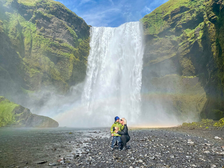 My guests by Skógafoss waterfall in Iceland, with a rainbow. Part of the South Coast Tour by Arctic Mike Iceland.