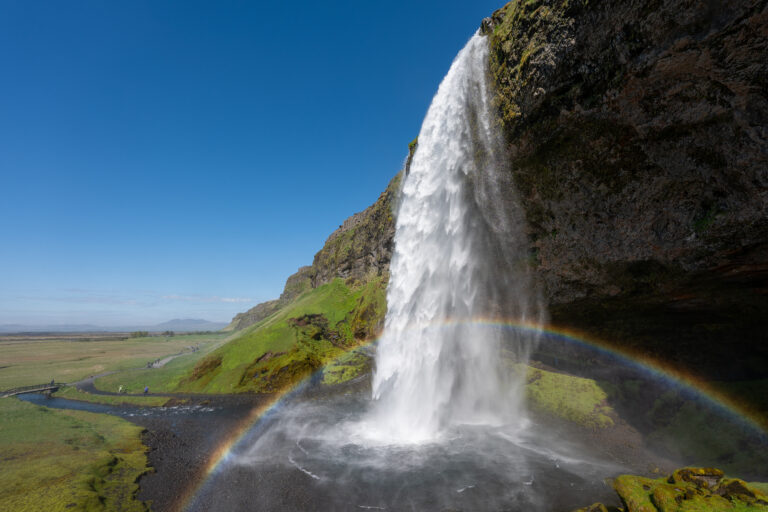 Seljalandsfoss waterfall in Iceland, with a rainbow. Part of the South Coast Tour by Arctic Mike Iceland.