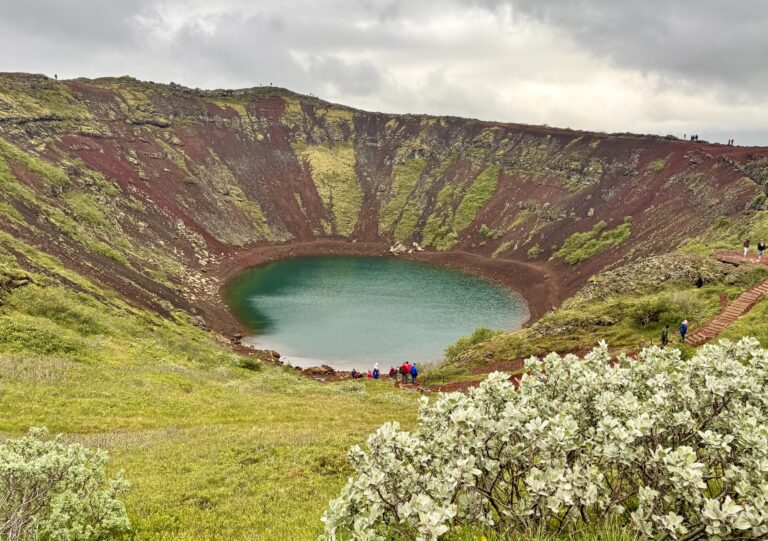 Picture of the view at Kerid Krater Waterfall on a cloudy summer day.