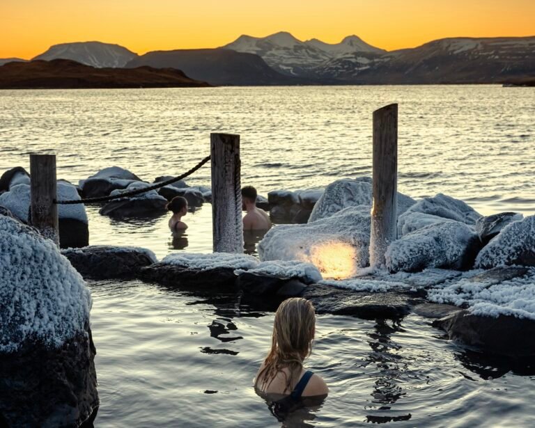 Picture of a woman relaxing in Hvammsvik hot spring