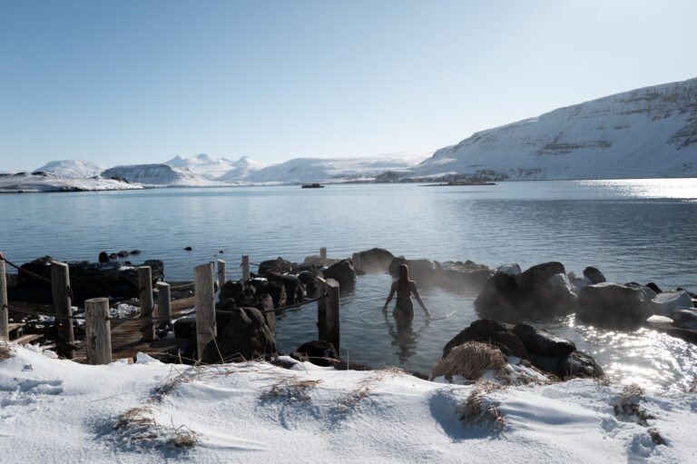 Picture of a woman relaxing in Hvammsvik hot spring