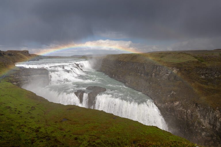 Picture of the view at Gullfoss Waterfall with the rainbow on a summer day.