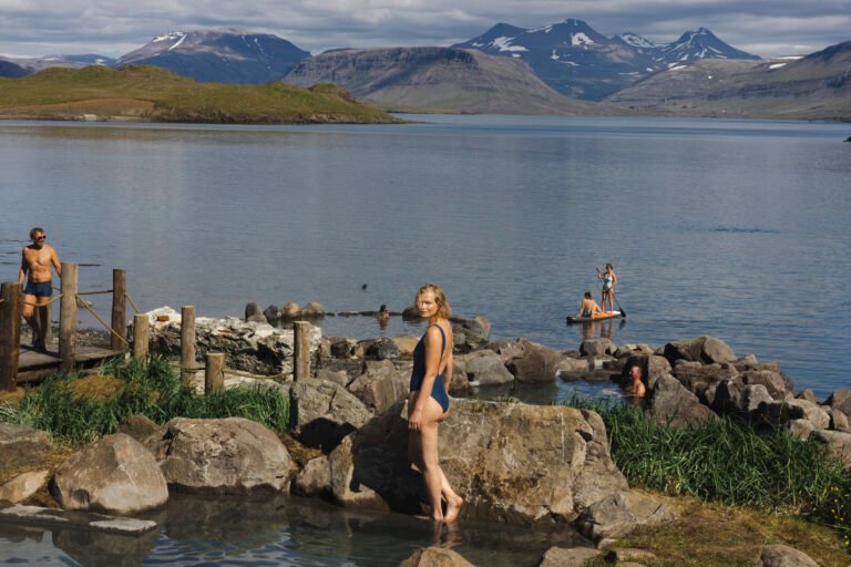 Picture of a woman relaxing in Hvammsvik hot spring
