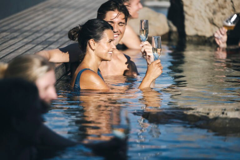 Picture of a couple relaxing in Hvammsvik hot spring