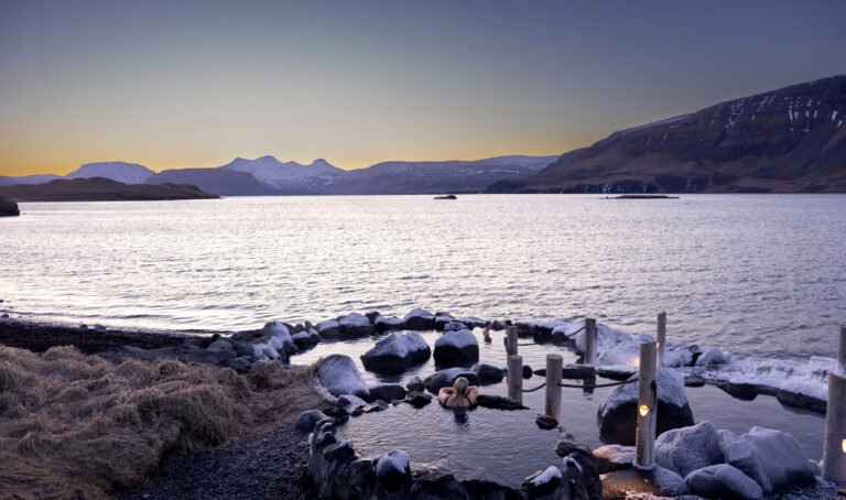 Picture of a woman relaxing in Hvammsvik hot spring
